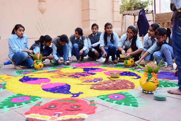 Students participate in rangoli competition at the Surajkund Mela