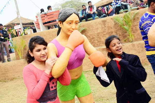 Young girls click pictures at Haryana Apna Ghar at Surajkund Mela